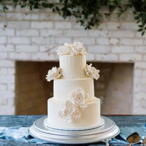 Three tier wedding cake with gumpaste flowers | Petite Sweets by Laura | Photo by Bailee Starr Photography