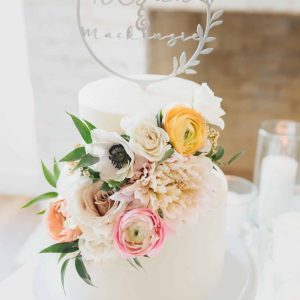 Multicolored pastel floral adorn this classic wedding cake | Petite Sweets by Laura | Photo by Bowtie Media