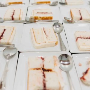 Slices of wedding cake ready for guests | Petite Sweets by Laura | Photo by Bowtie Media