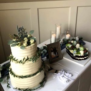 White wedding cake with greenery accents and letter C cake | Petite Sweets by Laura